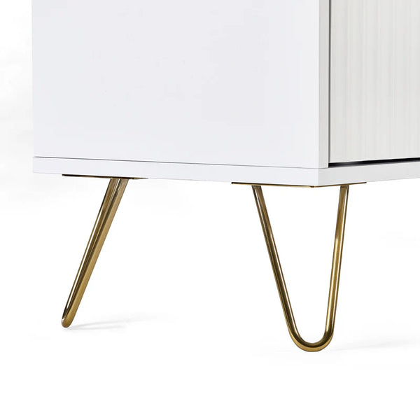 Close-up of a white cabinet with gold hairpin legs on a white background