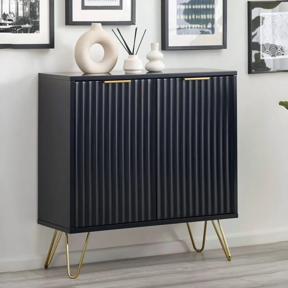Black cabinet with gold legs on a white background