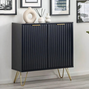 Black cabinet with gold legs in a room setting