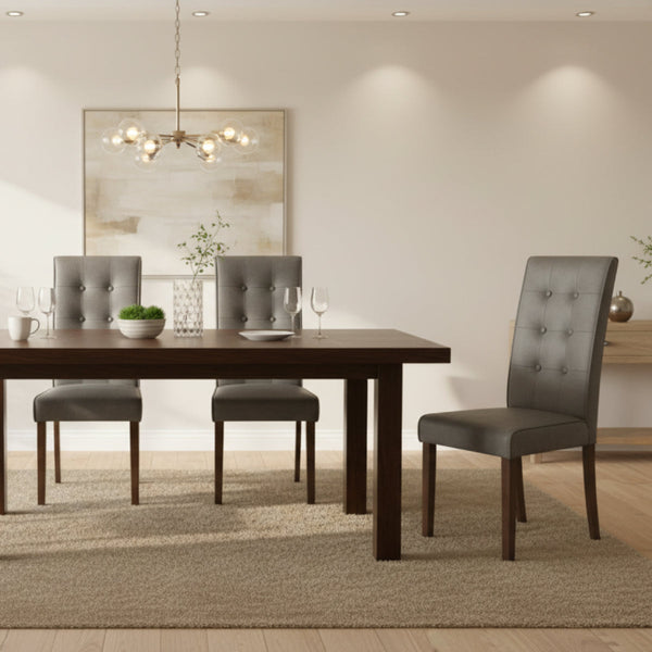 Dining room with a wooden table and gray chairs in a well-lit room.