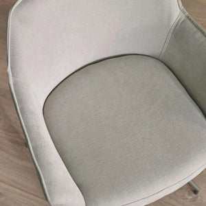 DINING CHAIR CLOSE UP ON THE SEAT WITH A WOODEN FLOOR 