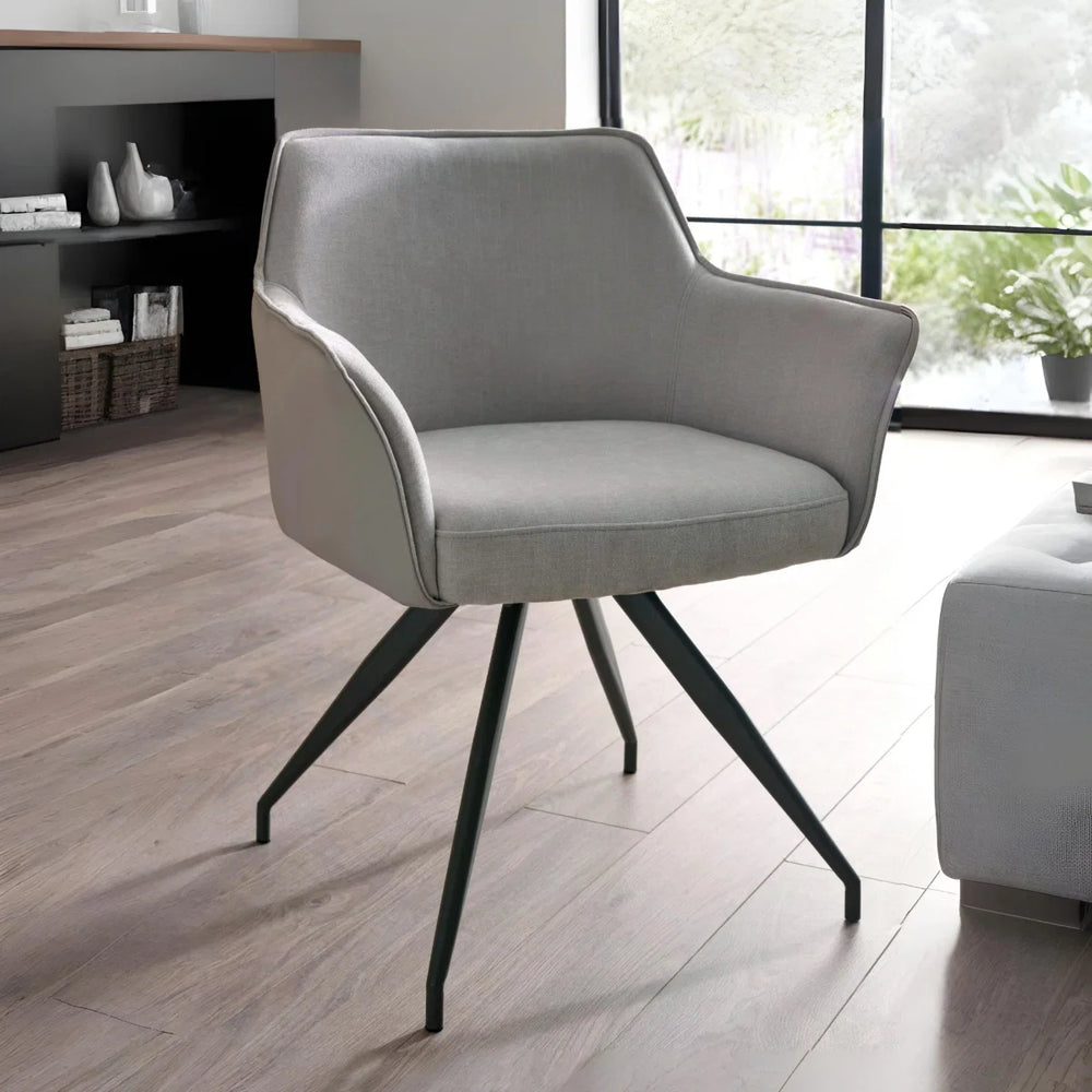 DINING CHAIR WITH BLACK METAL LEGS ON A WHITE BACKGROUND