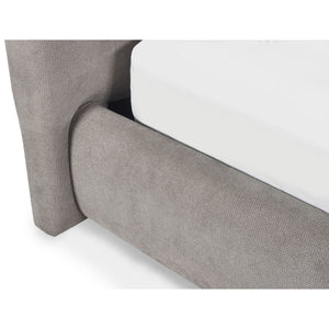 Gray upholstered bed frame corner on a white background