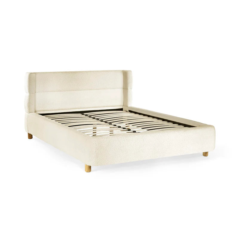 cream bed with a slatted base on a white background
