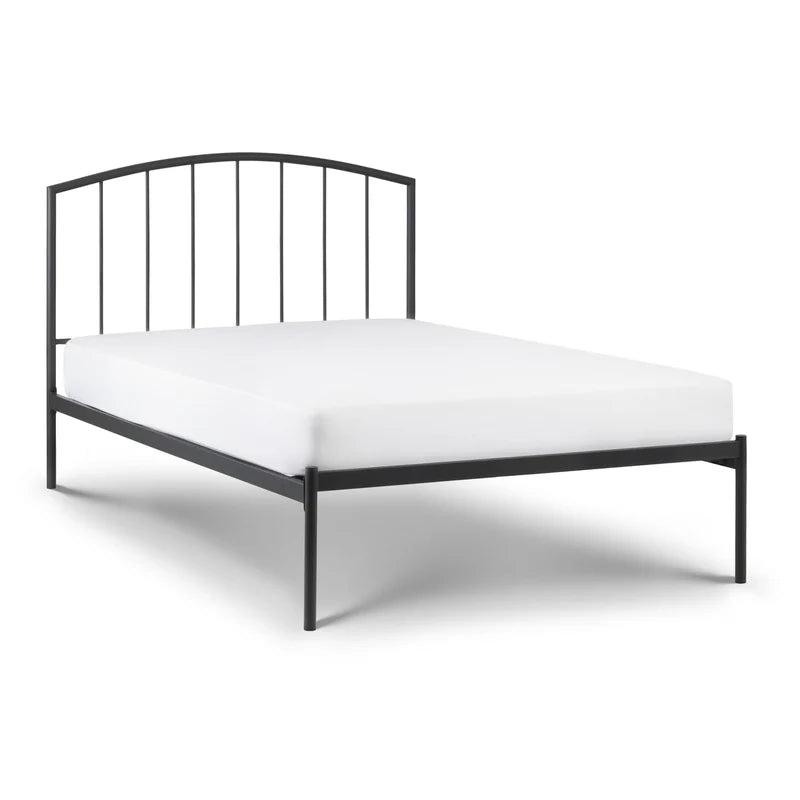 Black metal bed frame with white mattress on a white background