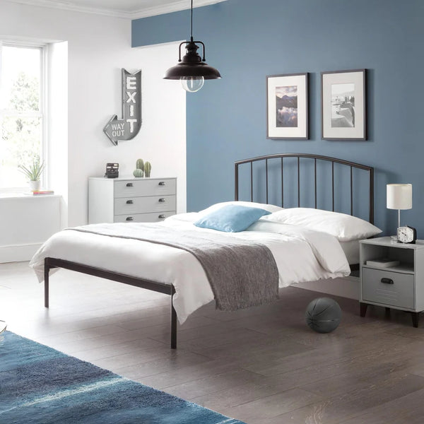 Modern bedroom with a metal bed, white bedding, and blue walls.