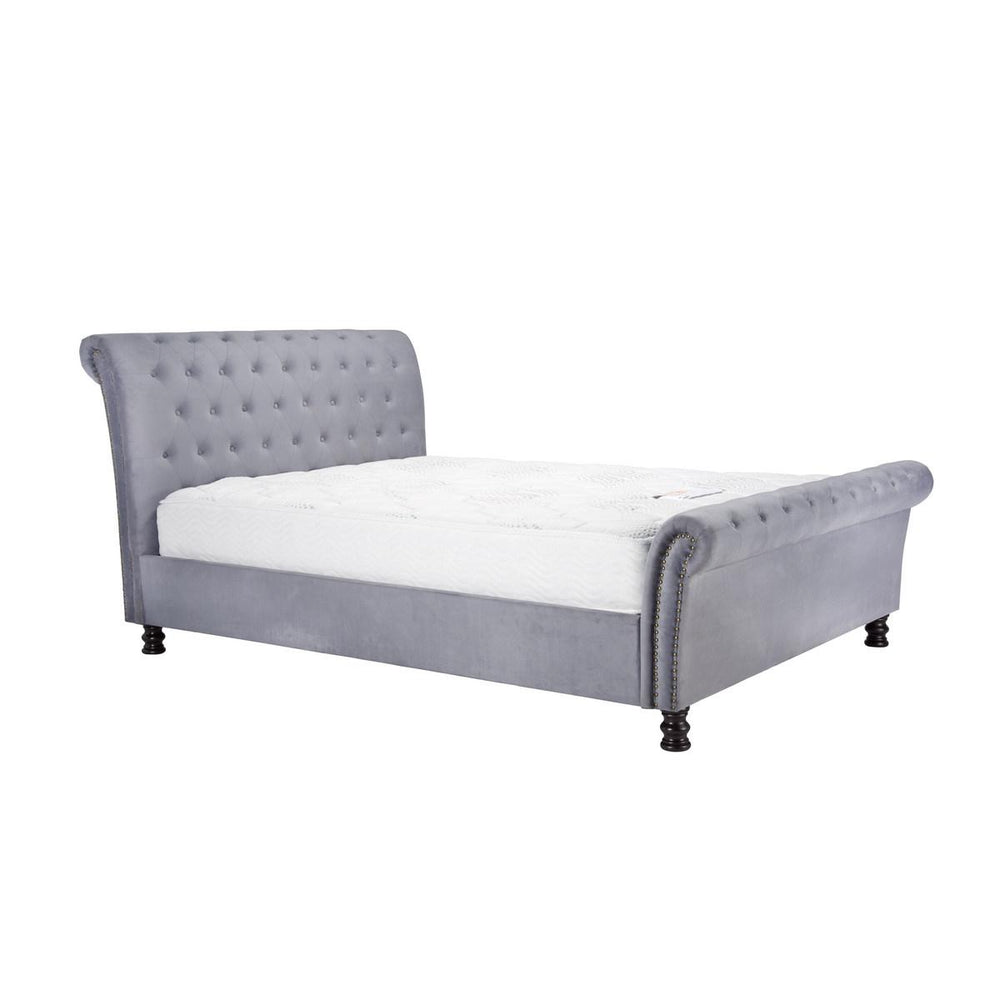 Gray upholstered bed with white mattress on a white background