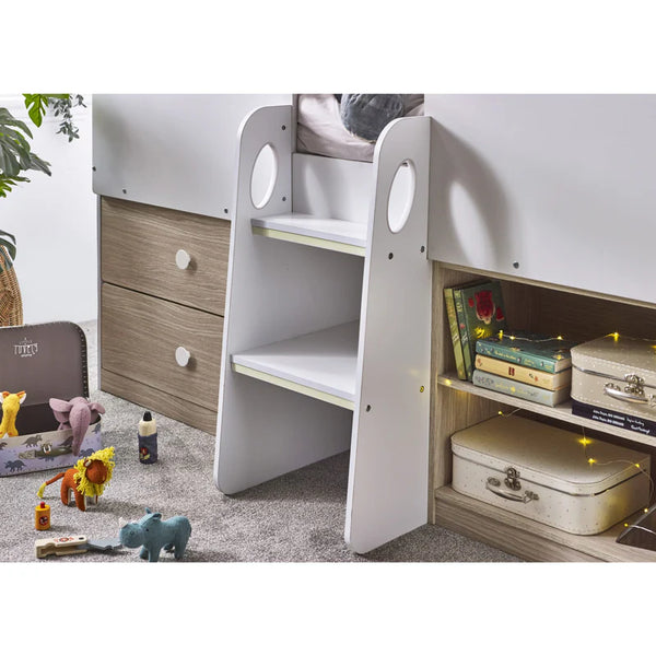 Children's room with a bed, shelves, and toys on the floor.