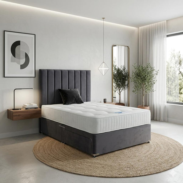 Modern bedroom with a bed, nightstands, and decorative elements.