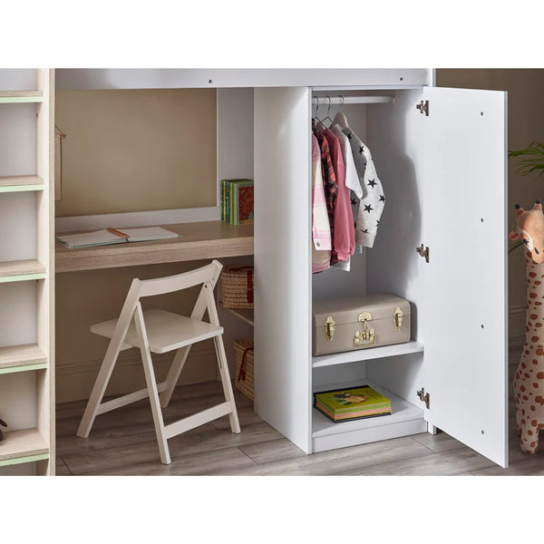 Children's room with a desk, chair, and wardrobe with clothes and a suitcase.