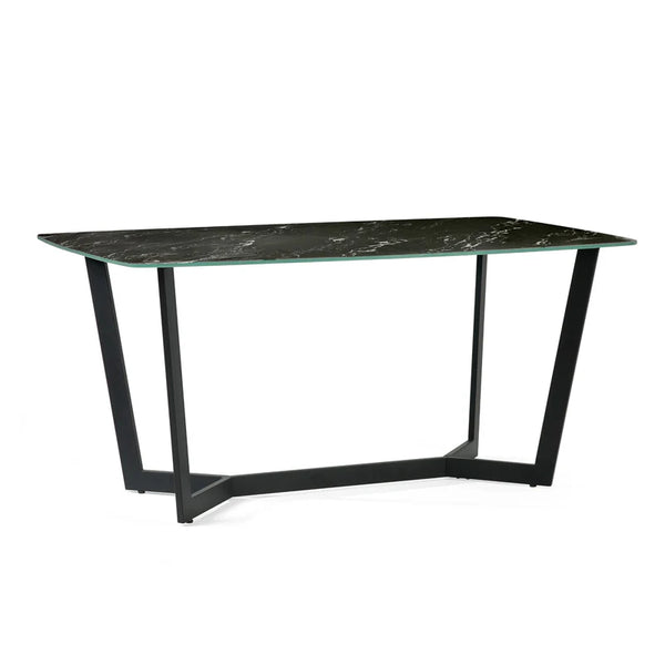 Modern dining table with black marble top and metal legs on a white background