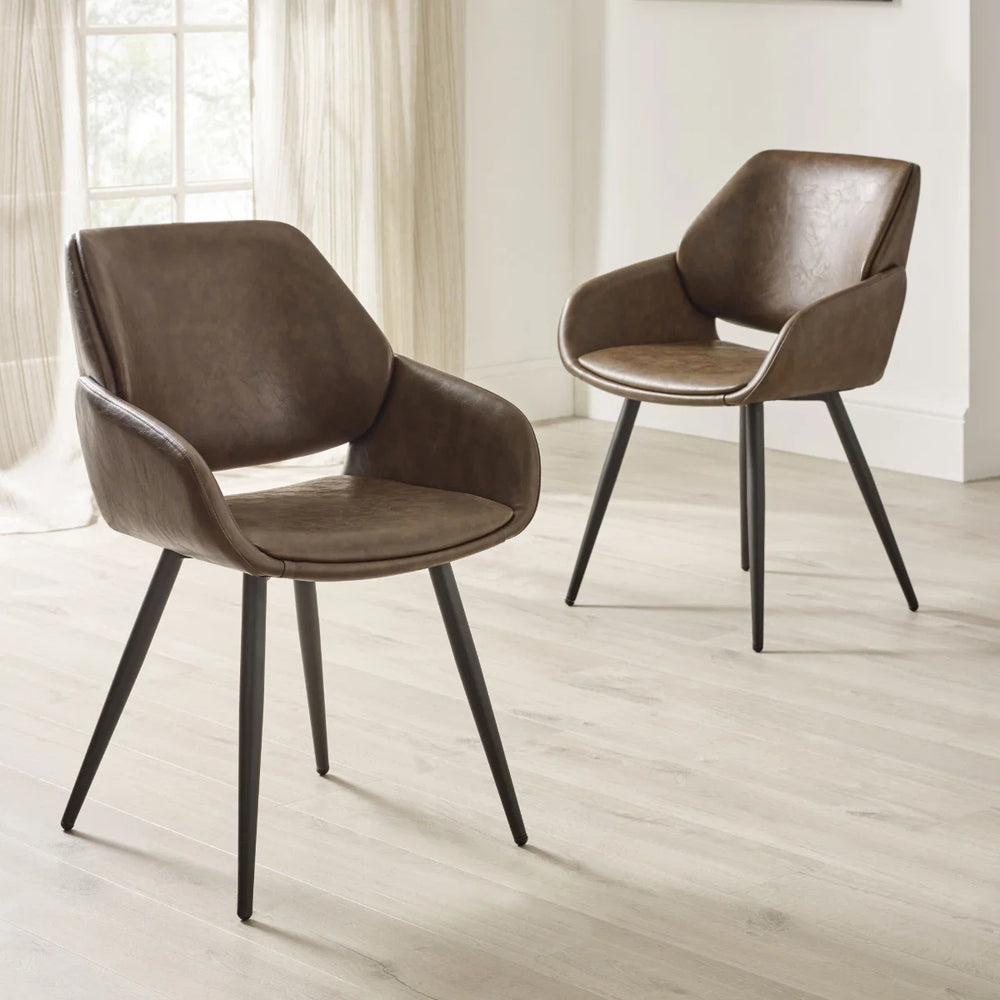 Brown leather armchair with black legs on a white background