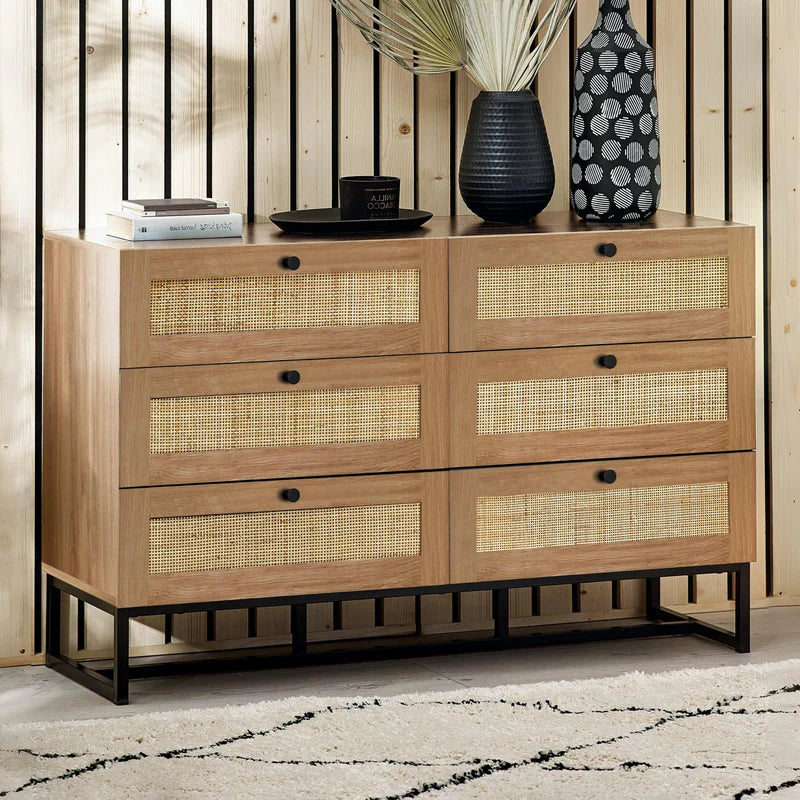 Wooden dresser with woven accents on a white background