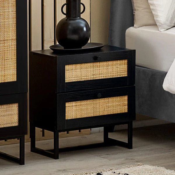Black nightstand with woven drawers in a bedroom setting