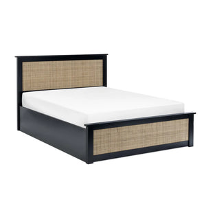 Bed with black frame and woven design on a white background