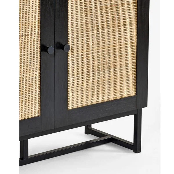 Black cabinet with woven design on doors against a white background