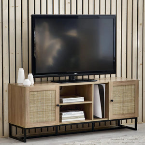 Wooden TV stand with a television on top against a wooden wall.