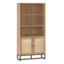 Wooden bookshelf with wicker doors on a white background