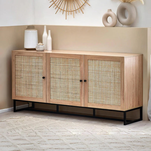 Wooden sideboard with wicker doors in a room setting