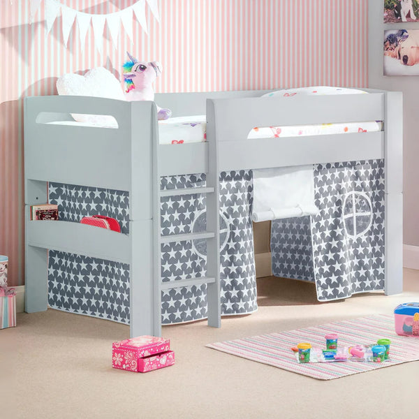 Children's room with a gray loft bed and star-patterned curtains.