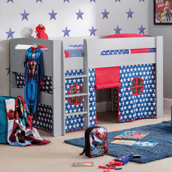 Children's bedroom with superhero-themed bed, toys, and decor.