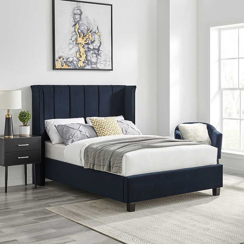 Navy blue bed frame with white mattress on a white background