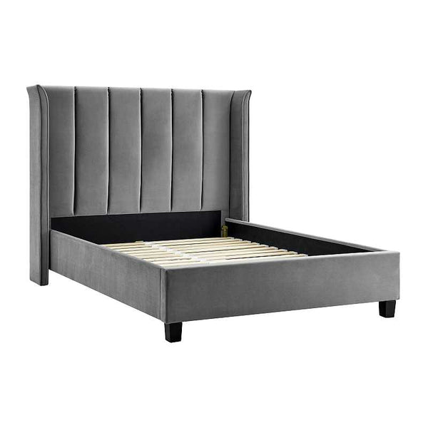 Gray upholstered bed with tufted headboard on a white background