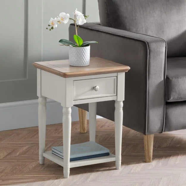 Small wooden side table with a white base on a white background