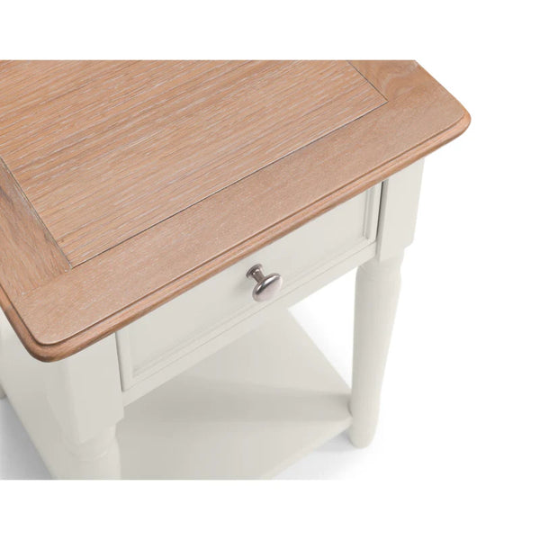 Wooden side table with a white base on a white background