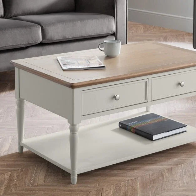 Wooden coffee table with white base on a white background