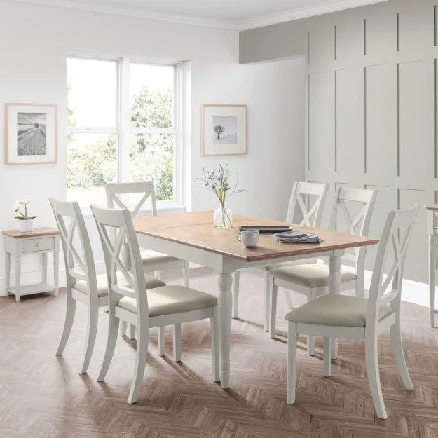 Dining table with wooden top and white base on a white background