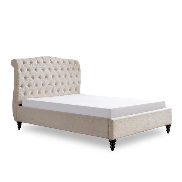 Beige upholstered bed with tufted headboard on a white background