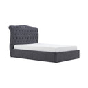 Gray upholstered bed with tufted headboard on a white background