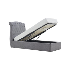 Gray upholstered bed with white mattress on a white background