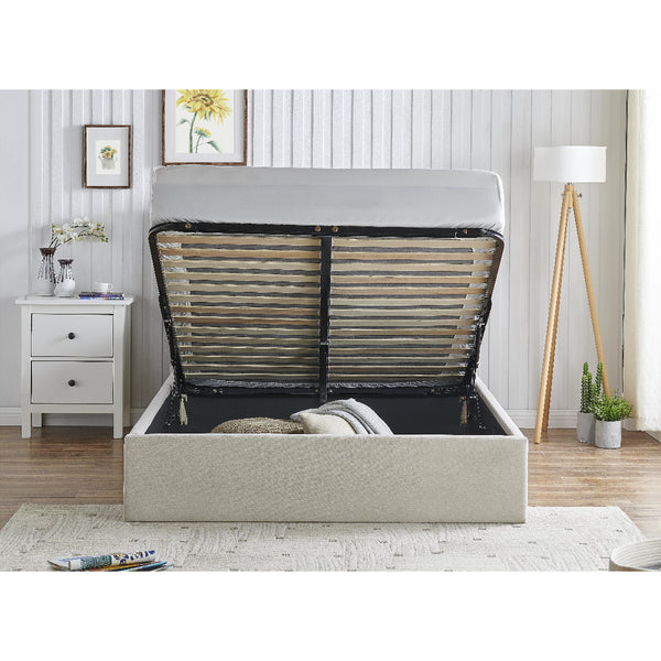 Beige bed frame with open storage compartment in a bedroom setting.