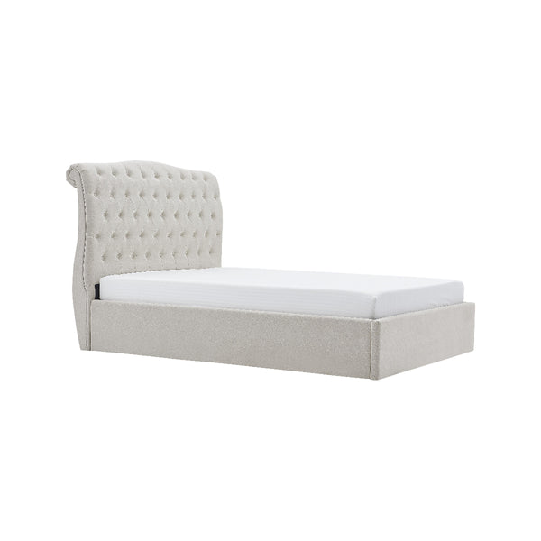 Light gray upholstered bed with tufted headboard on a white background