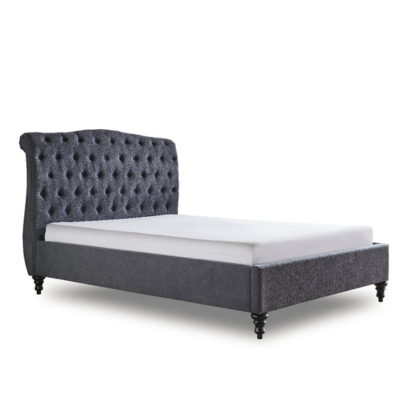 Gray upholstered bed with white mattress on a white background