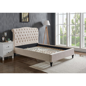 Beige upholstered bed with tufted headboard in a room with a window and side table.