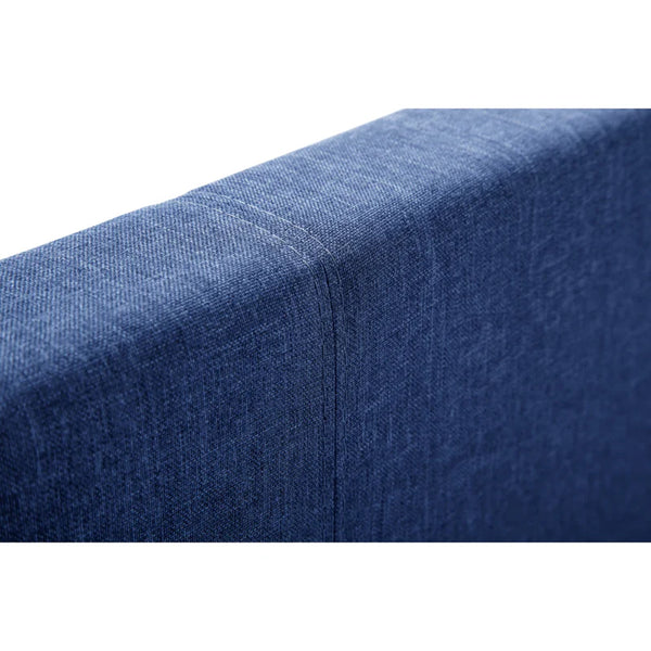 Close-up of a blue fabric surface with a subtle pattern