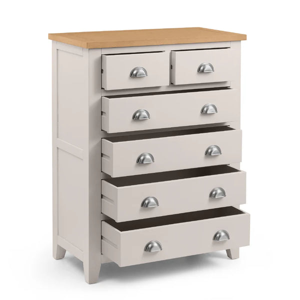 White dresser with multiple drawers and a wooden top on a white background