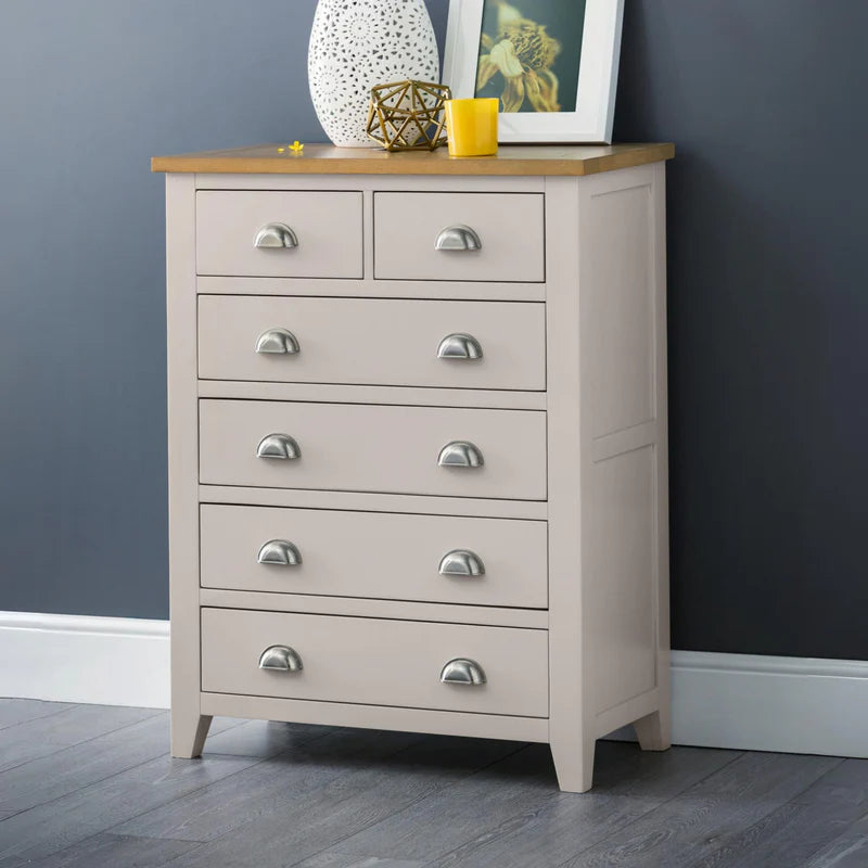 grey dresser with wooden top and silver handles on a white background