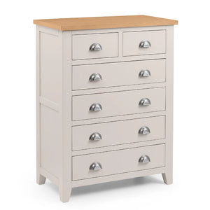 grey dresser with wooden top and silver handles on a white background