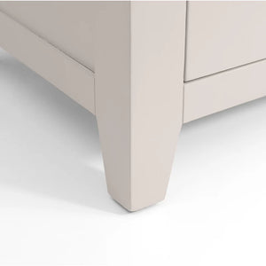 Close-up of a beige drawer corner on a white background