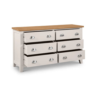 Grey dresser with six drawers and a wooden top on a white background