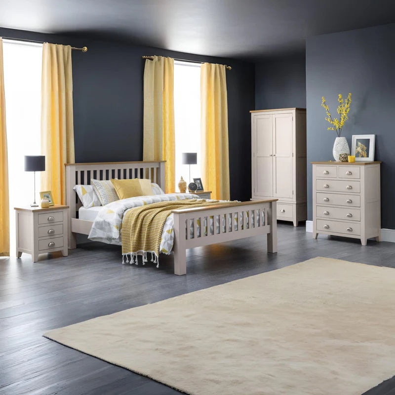 Grey dresser with six drawers and a wooden top on a white background