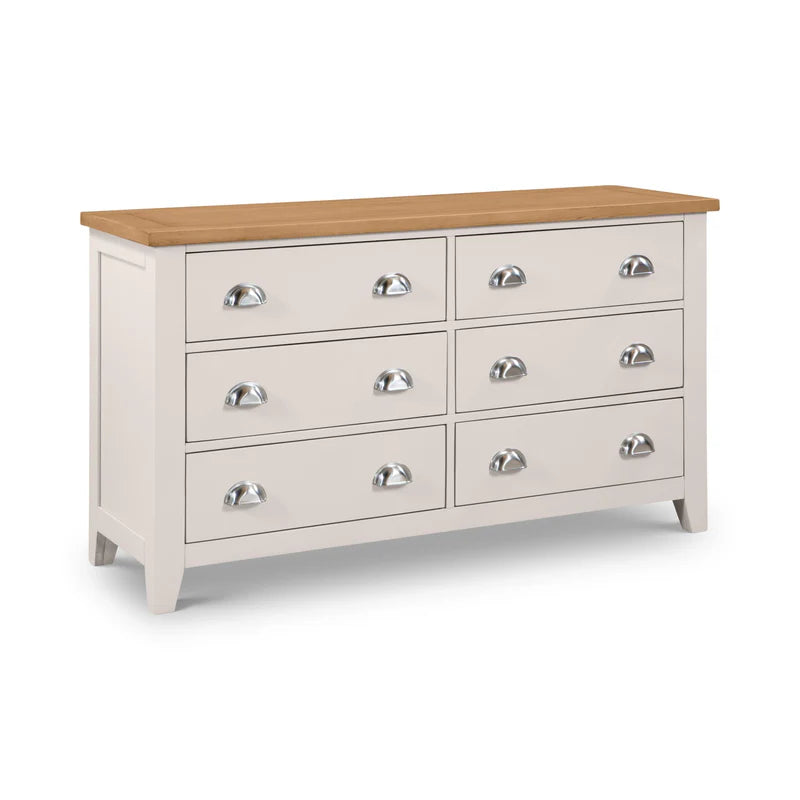 Grey dresser with six drawers and a wooden top on a white background
