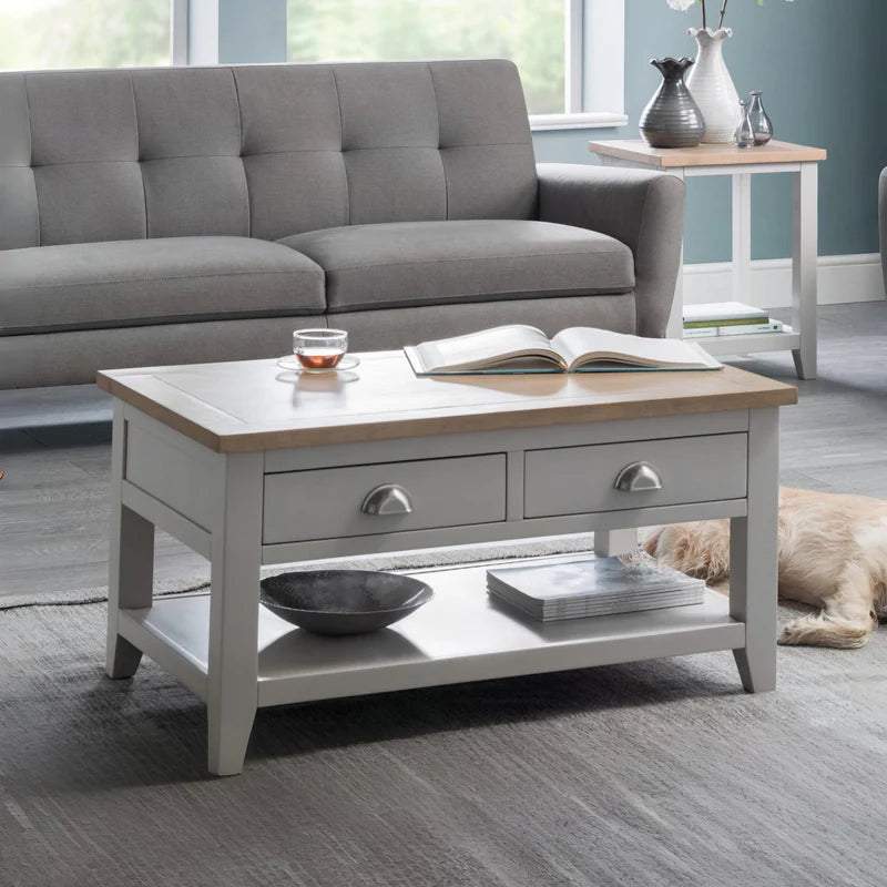 Wooden coffee table with two drawers on a white background