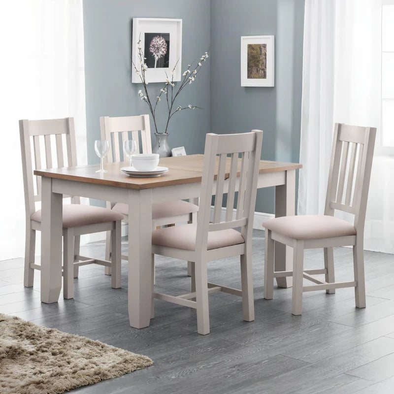 Wooden dining table with white base on a white background