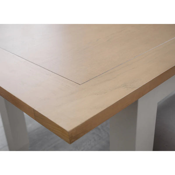Wooden table with a light finish on a white background