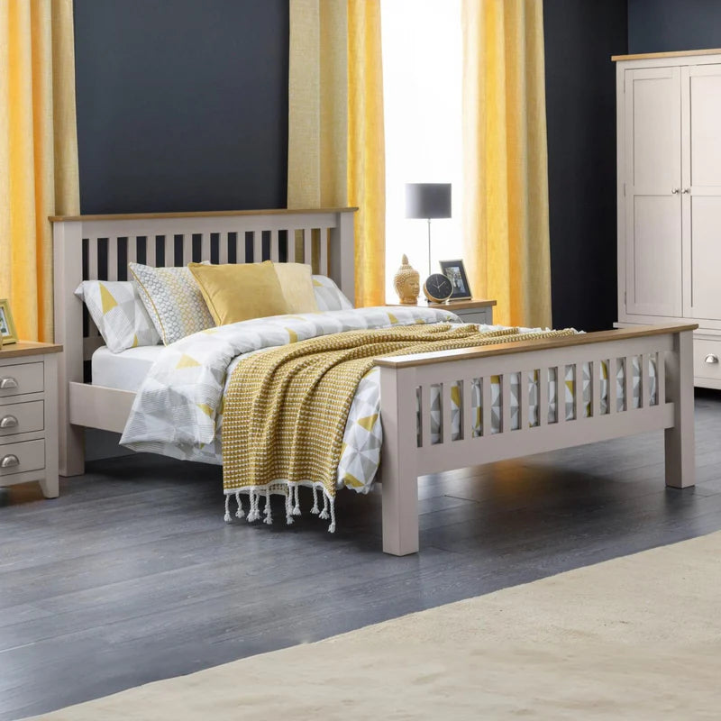 White bed frame with wooden top and footboard on a white background